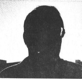 What appears to be a male person in silhouette sits for the photographer. Backlighting prevents us from seeing their face or any features.
